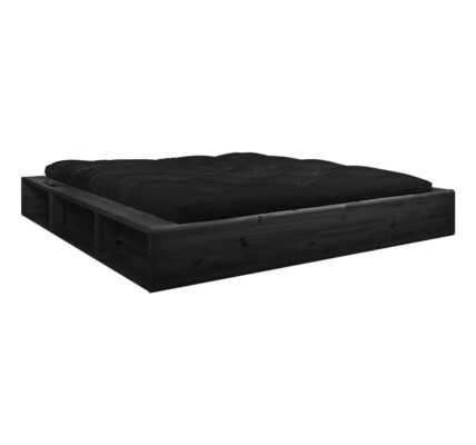 Čierna dvojlôžková posteľ z masívneho dreva s úložným priestorom a čiernym futonom Comfort Karup Design, 180 x 200 cm